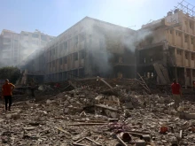 Palestinians stand on the rubble and debris of the Latin Patriarchate Holy Family School after it was hit during Israeli military bombardment in Gaza City on July 7, 2024, amid the ongoing conflict in the Palestinian territory between Israel and Hamas.