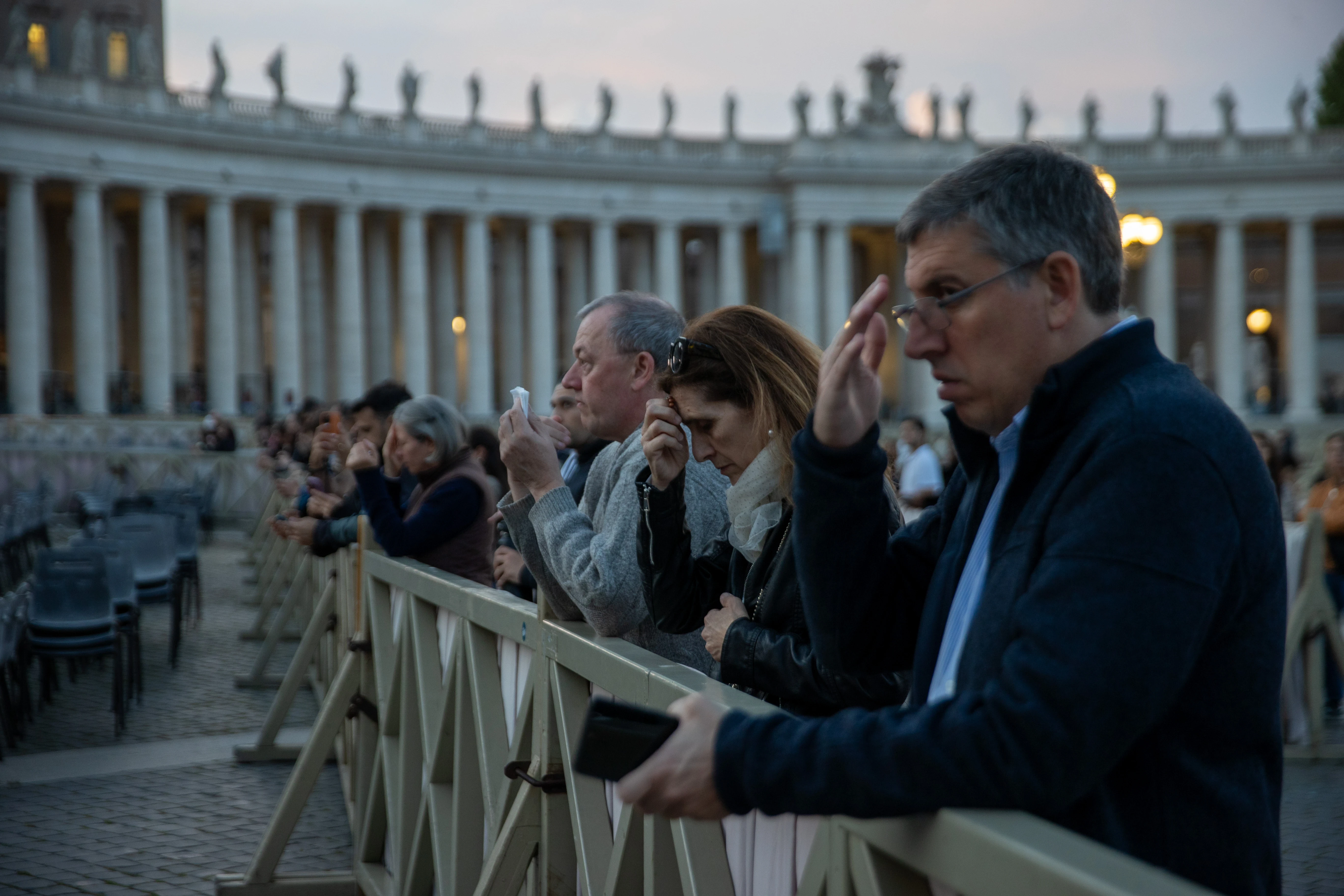 Faithful gather in prayer at the edge of St. Peter’s Square during the rosary for the late Pope Francis on Tuesday evening, April 22, 2025. | Credit: Daniel Ibáñez/CNA